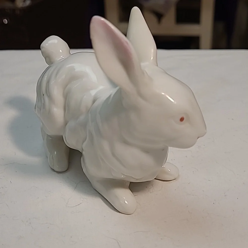 Vintage white bunny rabbit with pink eyes and pink ears.